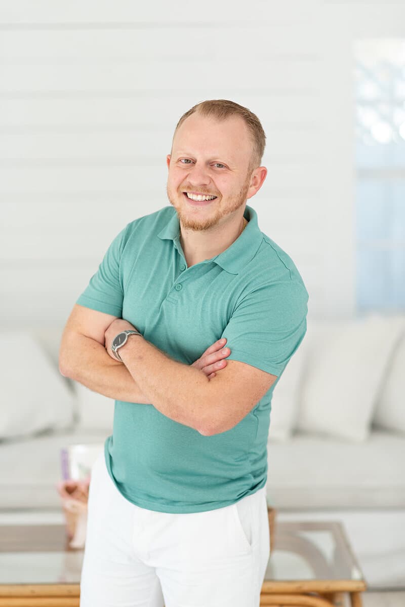 Entrepreneur in a green shirt during a bright branding portrait