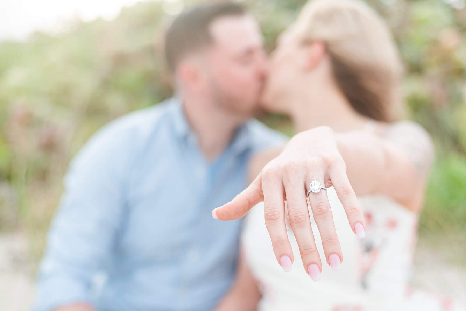 Ryan and Jessica celebrating their engagement outdoors