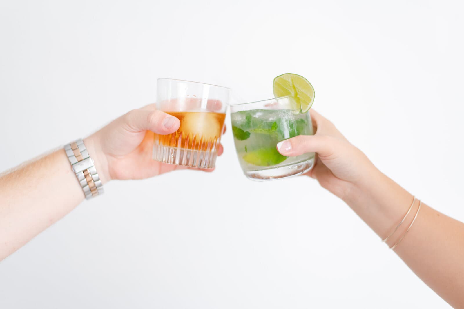 Two business owners toasting with drinks during a brand session